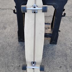 Custom made skateboard; maple and pine with a walnut stripe.