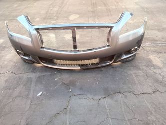 2009-2013 Infiniti M37 front bumper with fog lights and accessories.