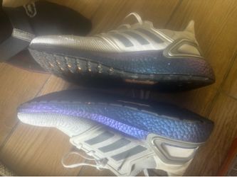 Adidas UltraBoost 20 running shoes. Designed