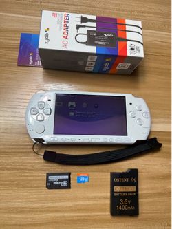 White PSP 3000 with 100 games installed.           W37