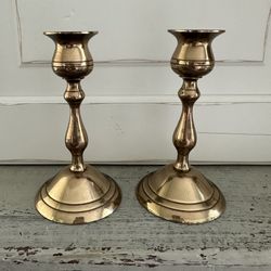 Set of two vintage brass candle stick holders. 5 1/2” tall x 3” across the base. 