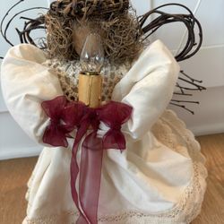 Angel holding candle 