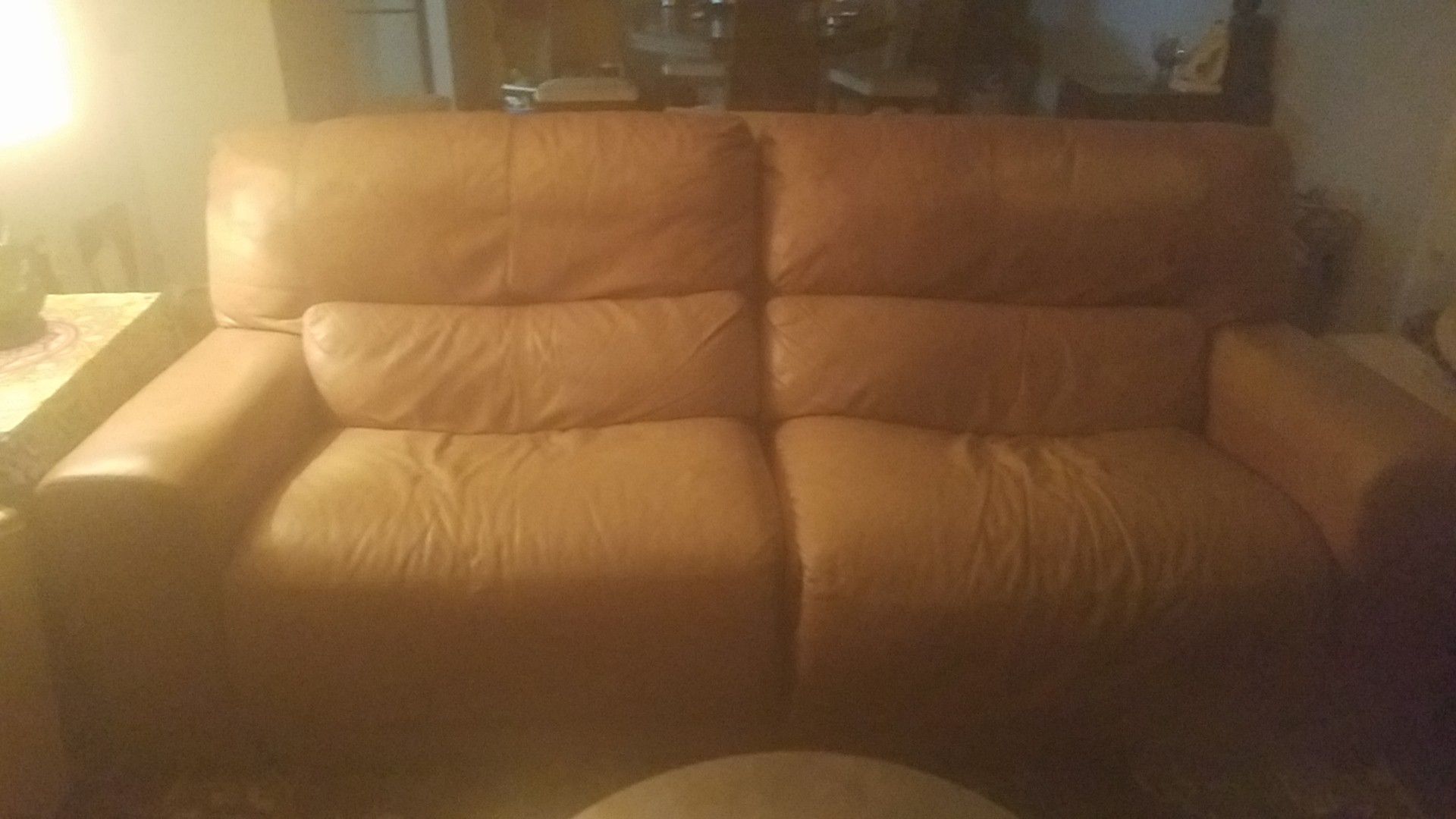 Reclining leather sofa