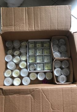 Lot of used glass votive and square white candles