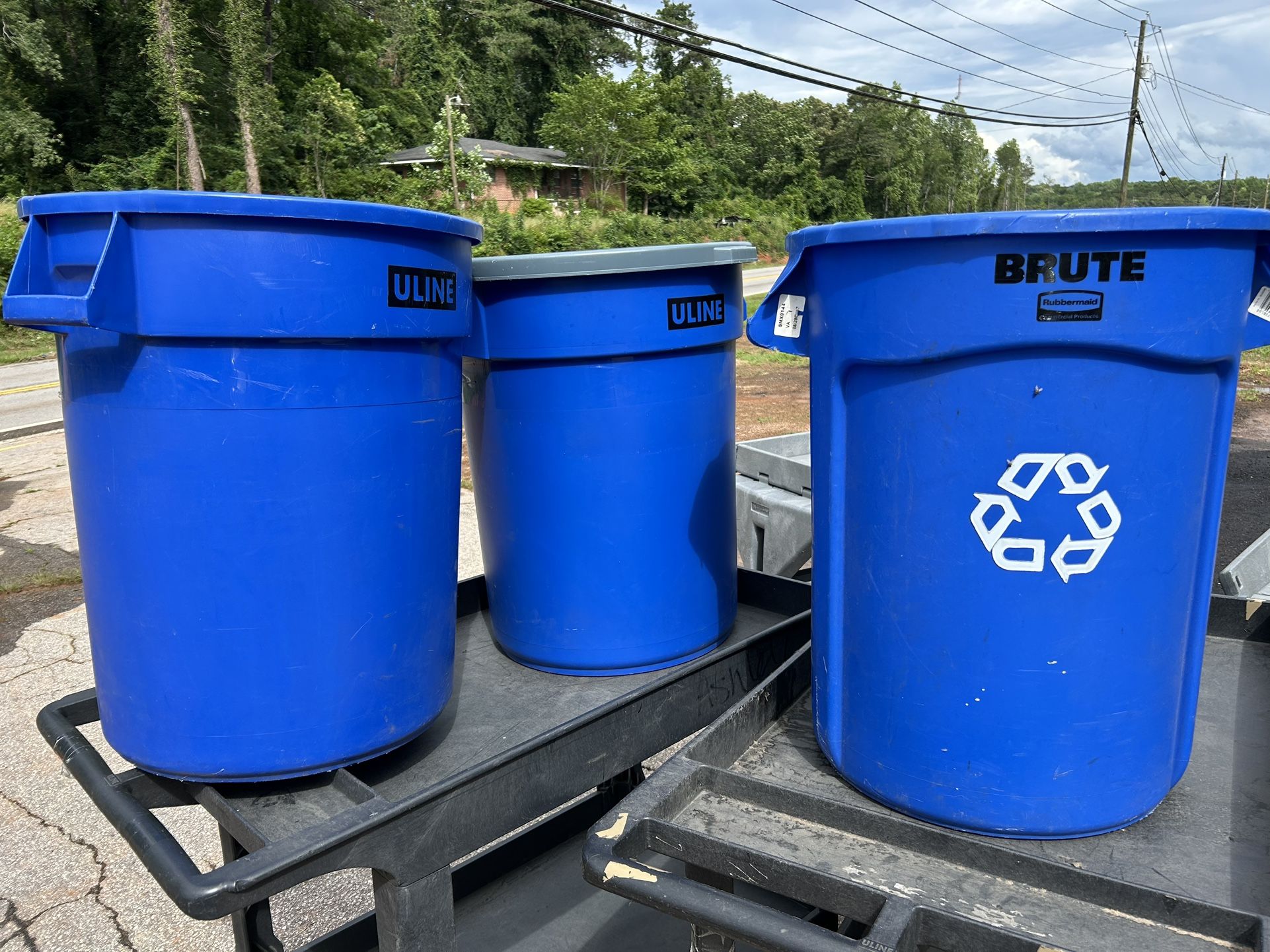 Three 32 Gallon Trash Cans.