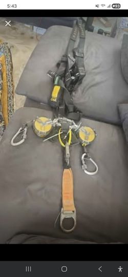 Profitionall industrial full-body fall protection safety harness kit primarily used for construction, roofing, or industrial work at heights. 
The set