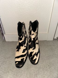 Woman’s exotic booties size 8.5