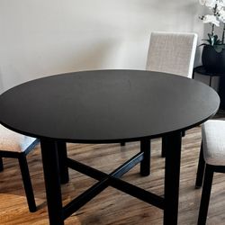 Round black dining table
