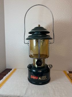 This vintage Coleman Model 288 Double Mantel Lantern CL2 in Amber Glass