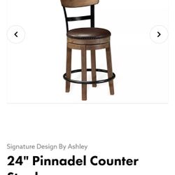 Signature Design by Ashley Pinnadel 24.25" Modern Farmhouse Swivel Counter Height Barstool