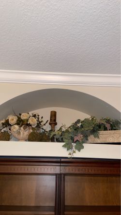 Artificial flowers and candle