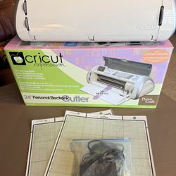 Cricut expressions complete with cables and two cutting mats with original box & 2 cartridges