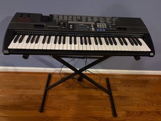 Electronic Keyboard w/stand, power cord. Works perfectly.