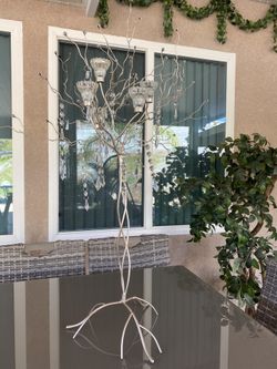 5 tier glass candelabra with crystal hanging for the table in light gold. Beautiful for any event.