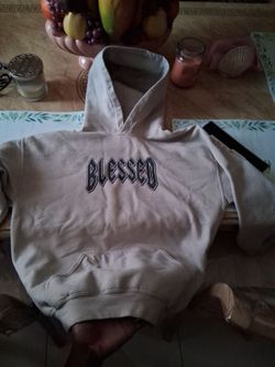Kahki jacket that says "blessed"