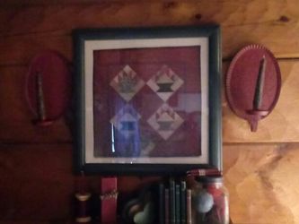 Quilt square pic with 2 red punched tin candle sconces