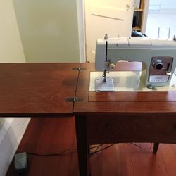 Antique Sewing Machine And Table
