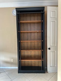 Tall wooden shelve/ bookcase
