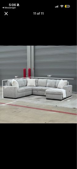 Light grey sectional couch w/ storage and sleeper bed
