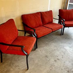 Pretty little three-piece outdoor patio set in excellent condition. Includes one loveseat, and two lounge chairs. Great for smaller spaces. Black alum