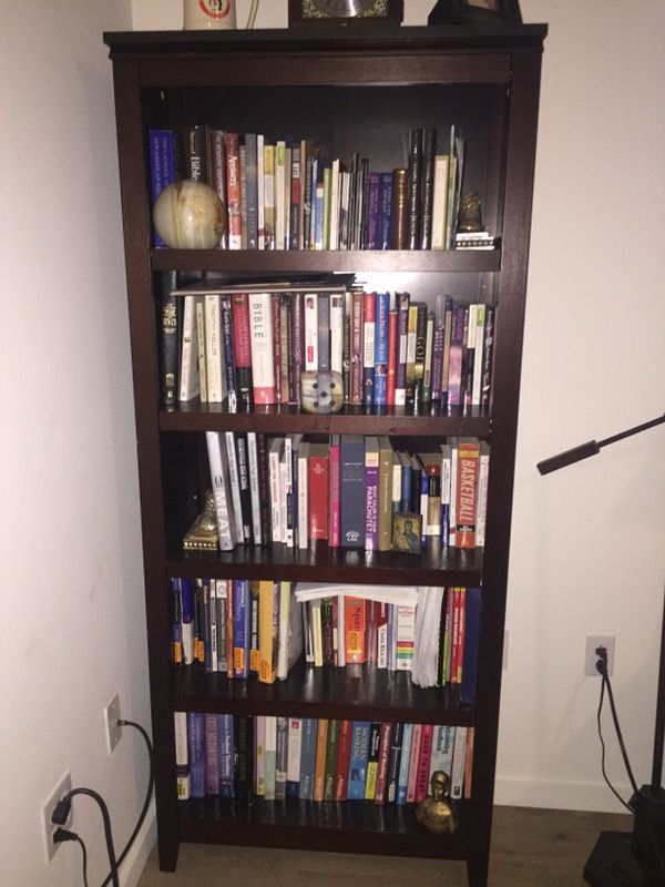 Tall brown wooden bookcase from Target