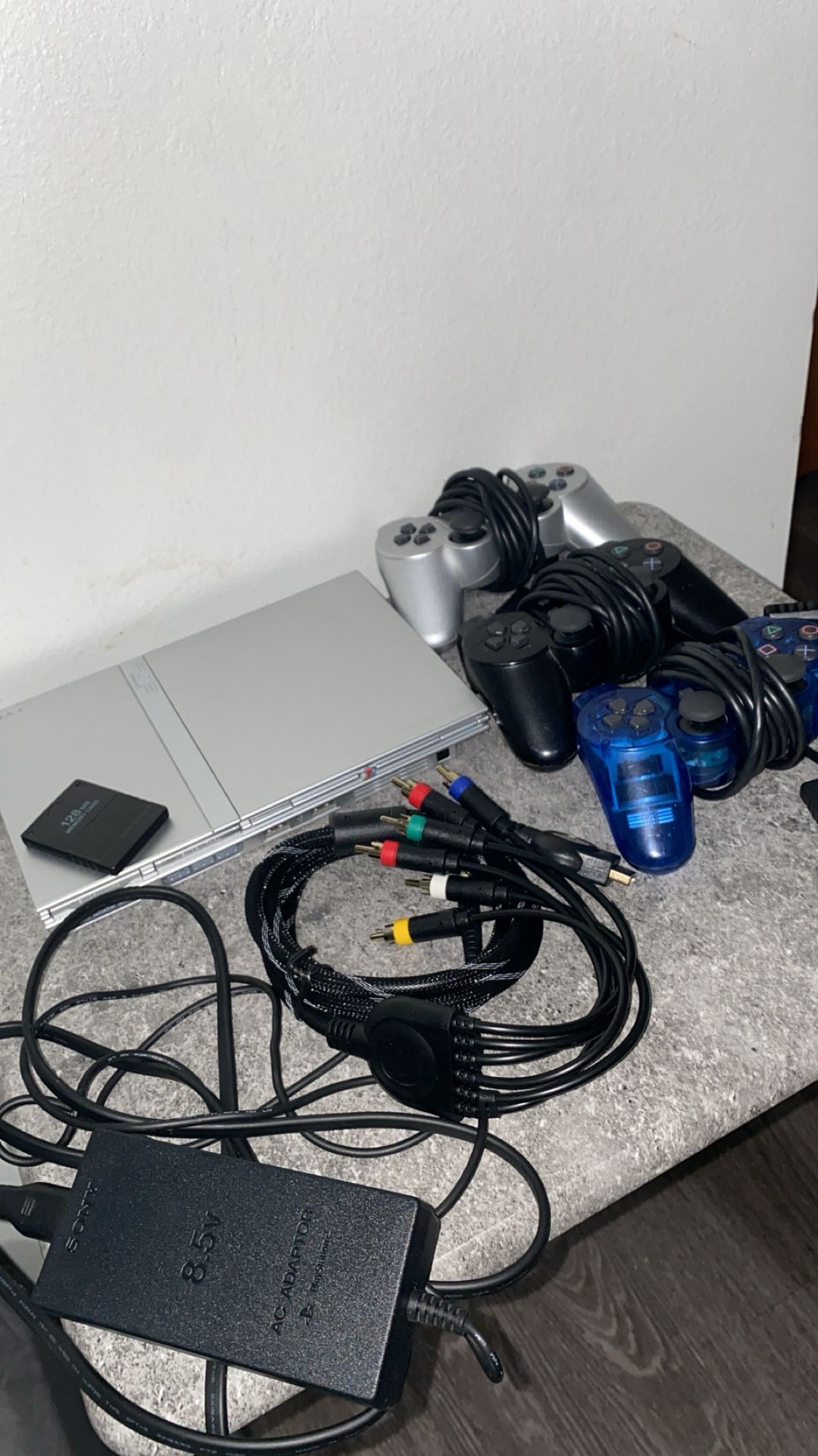 180$ OBO . silver ps2 with 3 controllers, games, memory card and all cables
