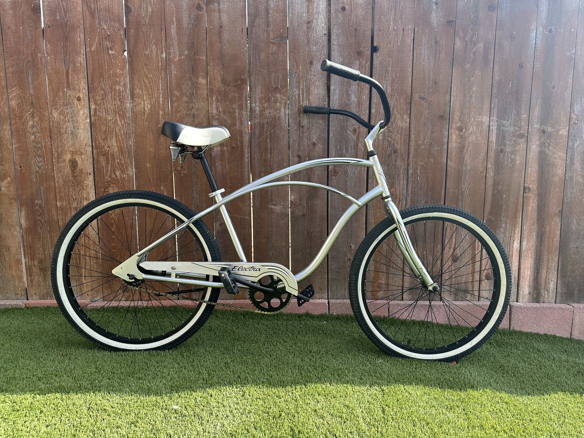 Electra Cruiser 1. Mens beach cruiser. Bright silver 26 inch. Rides smooth. 