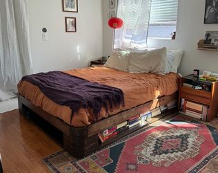 Custom built wooden queen bed frame