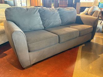 Steel Grey Three Seater Couch with Attached Back Cushions