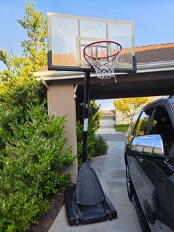Basketball hoop, mobile, water filled base, adjustable height,  good shape