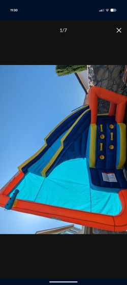 Inflatable slide, runs water from hise