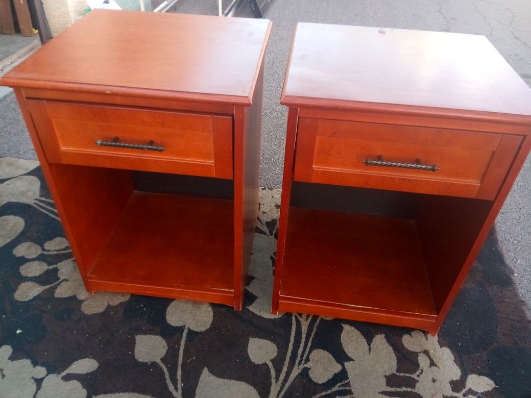 Two matching wooden nightstands by braman furniture