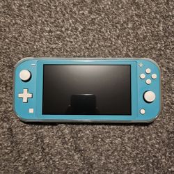 Nintendo Switch Lite + Extras