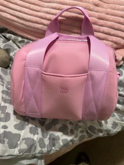 This is the pink Miniature Duffel Bag