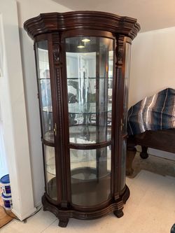 Large curio cabinet with glass shelves