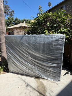 Box Spring Wrapped in Plastic
