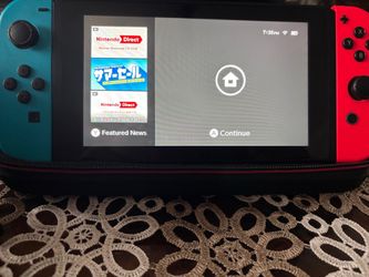 Nintendo Switch System +  Carrying Case + 128 GB SD Card