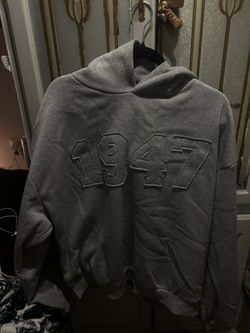 grey stitched 1947 hoodie .