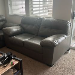 Two Grey Faux leather Couches