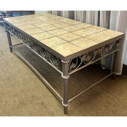 Tiled coffee table with a decorative metal frame. Removable tiles