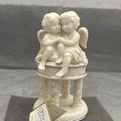 Lenox wedding promises cherubs angels sitting atop cake columns wedding topper