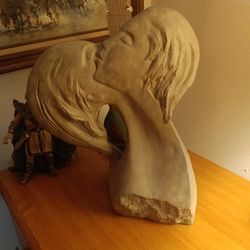 Sculpture pictured is the faces of love by David Fisher pottery sculpture 1980.