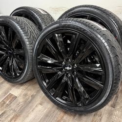 New 24 inch gloss black Gm style wheels wrapped in Lexani 305/35r24 tires