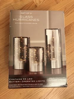 Brand new- Decorative glass hurricanes (set of 3). Contains 55 LEDs. 9”,7”and 5” High Price is firm