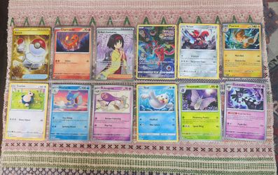 12 Pokémon Cards from 2023, incl a Hyper Rare Gold and an Ultra Rare FA