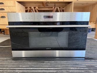 Wolf 30 inch E series built-in drop-down door Microwave oven – excellent condition .