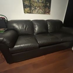Black Couch, Chair, And Ottoman