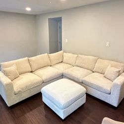 corduroy Sectional Sofa with Ottoman and 2 accent pillows.