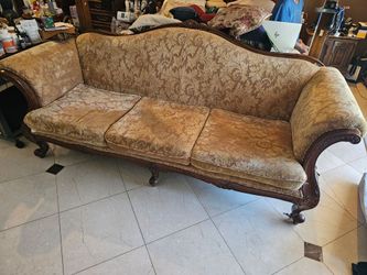 Victorian style couch with cushions