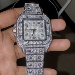 fully iced, square face, Roman numerals Cartier Santos style watch